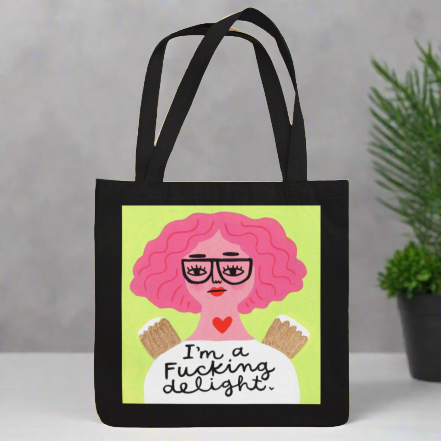 Black tote bag with Grumpy Angel Art "I'm a Fucking Delight"